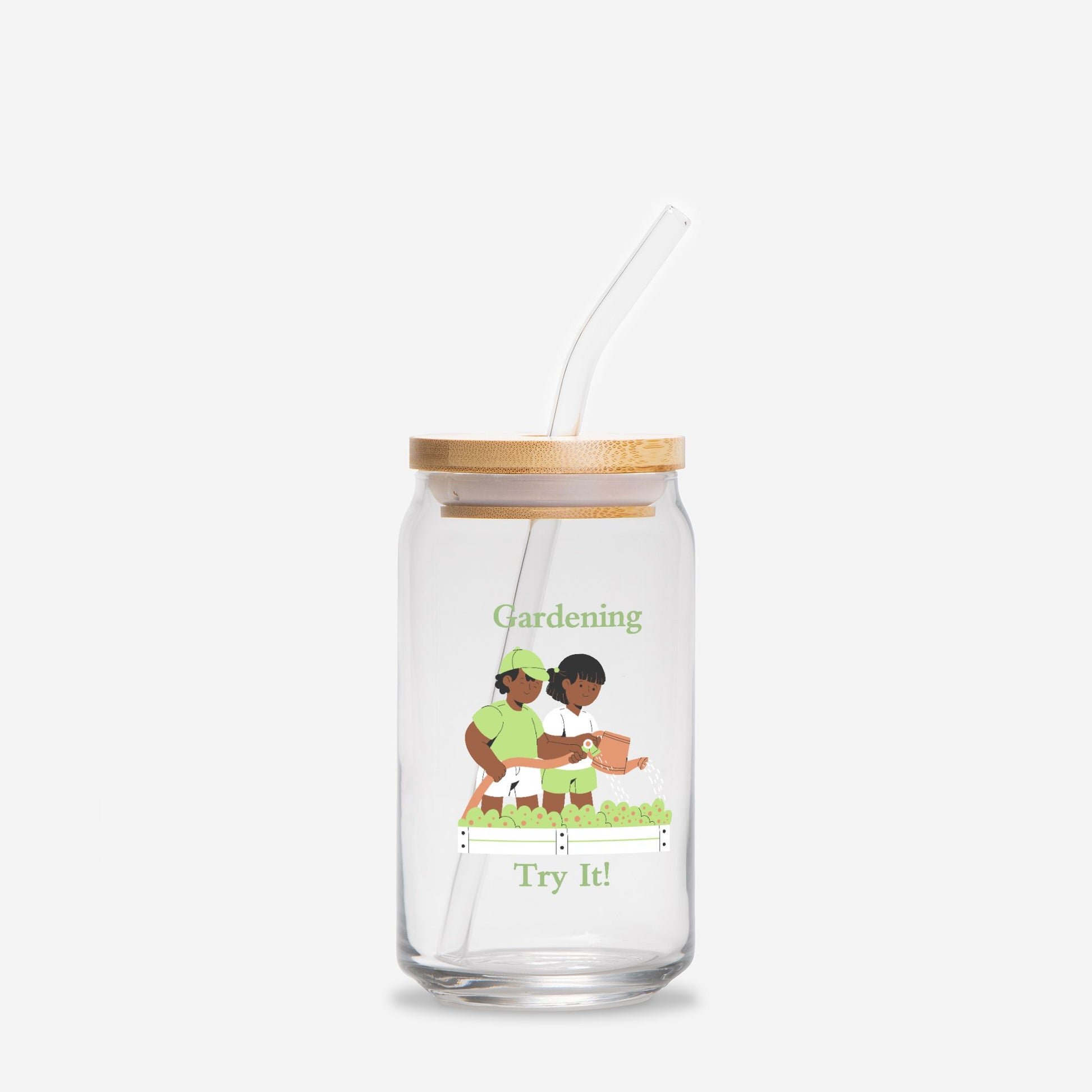 Clear glass tumbler with bamboo lid and straw featuring an illustration of two children gardening on a white background.