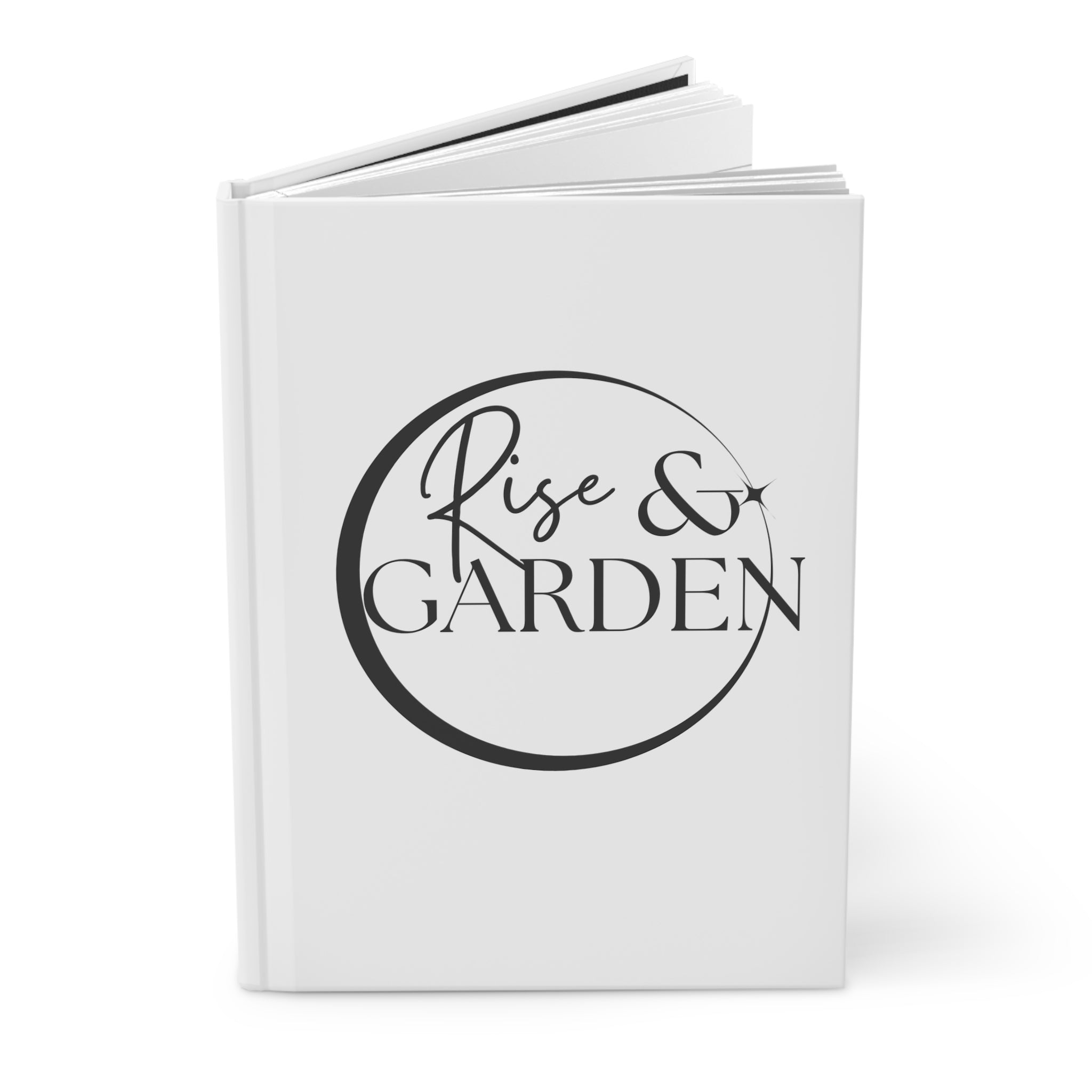 White notebook with 'Rise & Garden' text on a white background