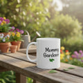 White mug with 'Mommy Gardener' text and a leaf design on a beige background