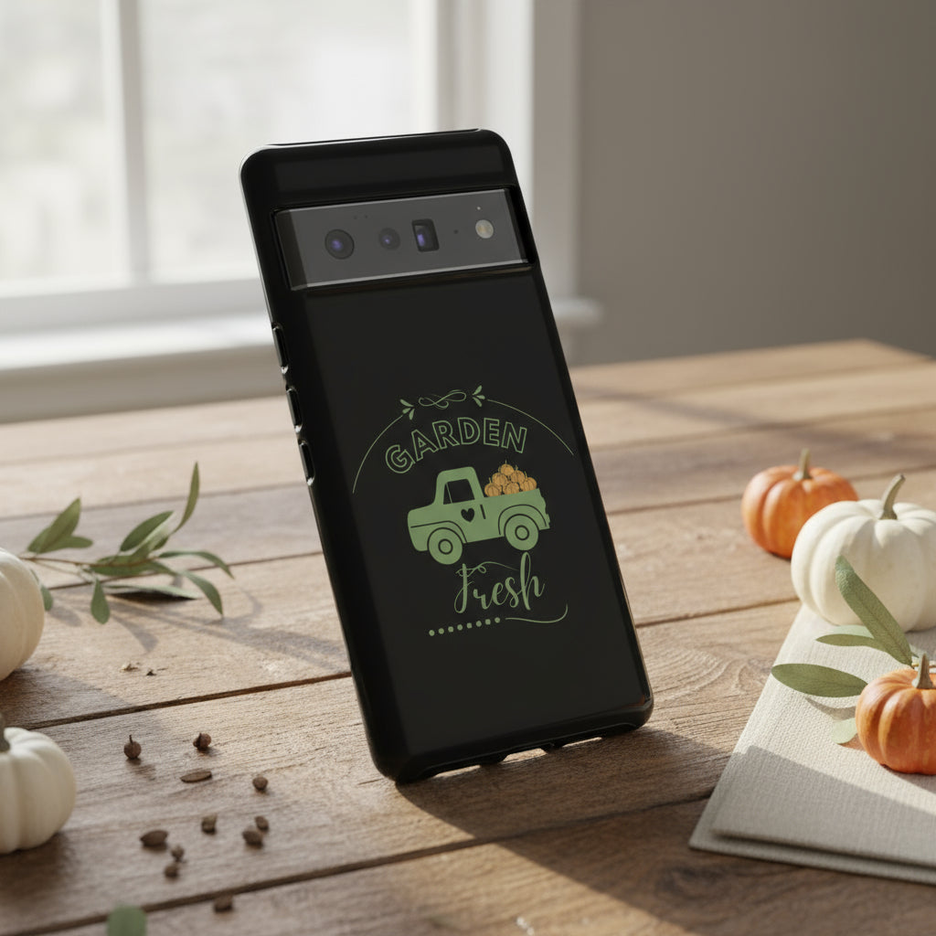 Phone case with a green truck and 'Garden Fresh' text on a black background