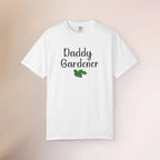 White t-shirt with 'Daddy Gardener' text and a leaf graphic on a beige background
