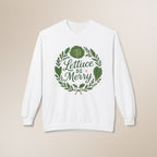 White sweatshirt with 'Lettuce Be Merry' design on a beige background