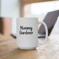 White mug with 'Mommy Gardener' text on a wooden surface