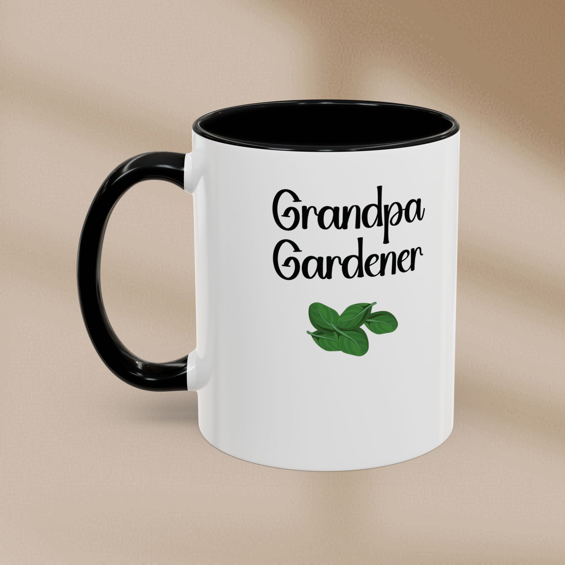 White mug with black handle and 'Grandpa Gardener' text on a beige background