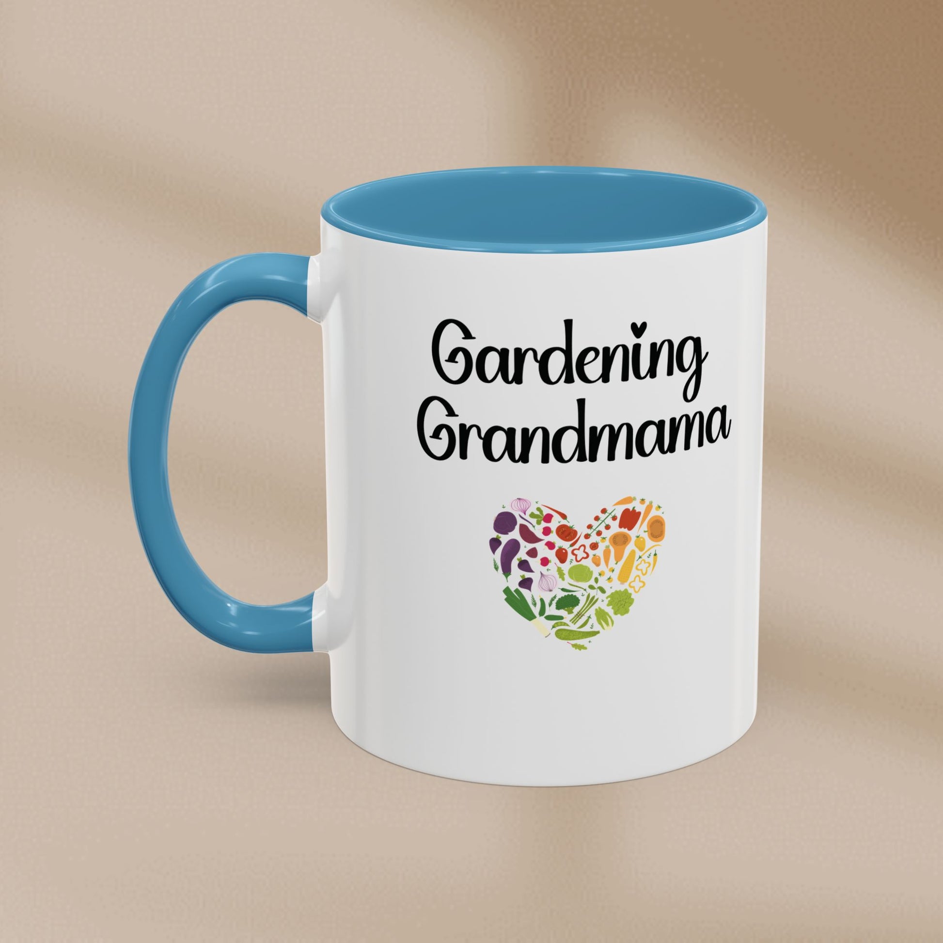 Mug with 'Gardening Grandmama' text and heart-shaped floral design on a beige background