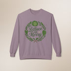 Purple sweatshirt with 'Lettuce Be Merry' design on a beige background