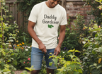 Person wearing a 'Daddy Gardener' t-shirt in a garden setting