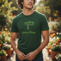 Man wearing a green 'Garden Strong' t-shirt in a garden setting