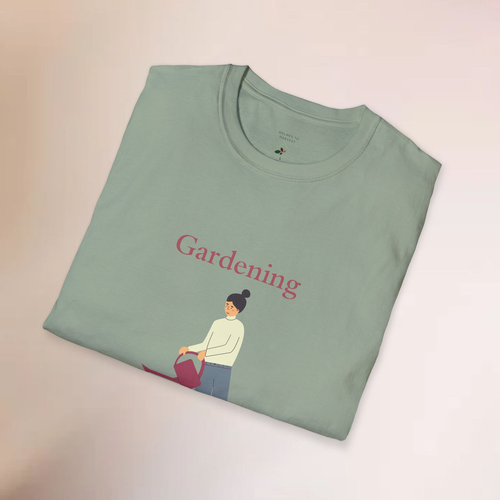Folded green t-shirt with 'Gardening' text and graphic on a light background
