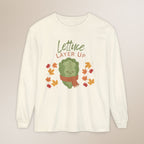 White long-sleeve shirt with a cartoon lettuce character and 'Lettuce Layer Up' text on a beige background