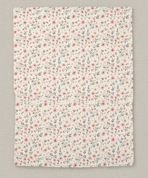 Floral patterned paper with small pink flowers on a white background