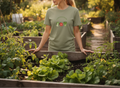 Person wearing a green t-shirt with vegetable graphics in a garden setting