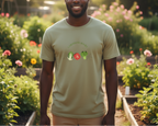 Man wearing a light green t-shirt with vegetable graphics in a garden setting