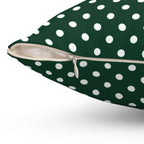 Green pillow with white polka dots on a white background