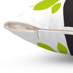 Close-up of a pillow with green leaf patterns on a white background