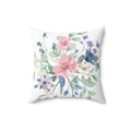 Floral pillow with pink and blue flowers on a white background