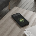 Black phone case with a green truck design on a wooden surface