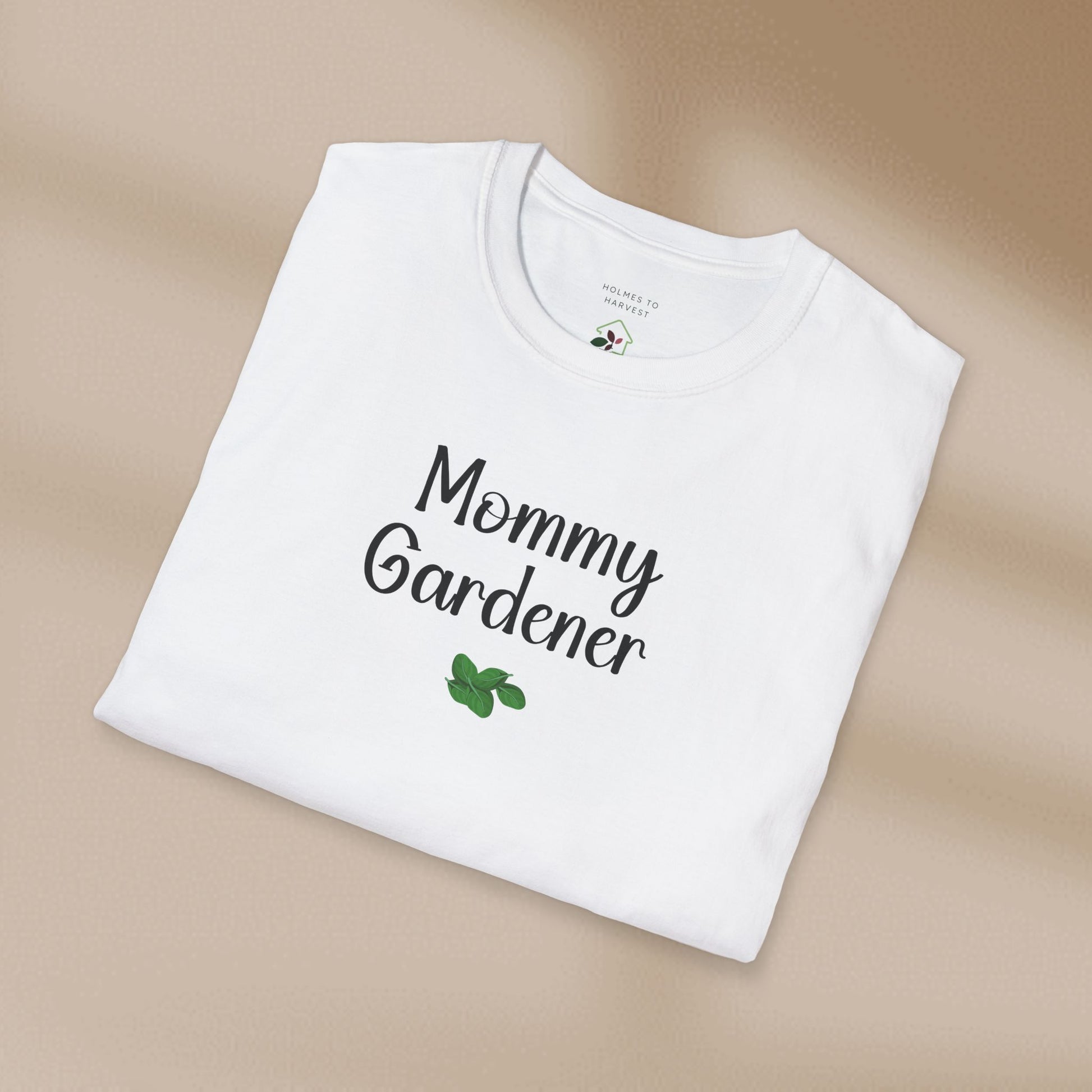 White t-shirt with 'Mommy Gardener' text on a beige background
