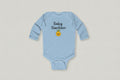 Light blue baby onesie with 'Baby Gardener' text and emoji on a white background