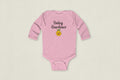Pink baby onesie with 'Baby Gardener' text and emoji on a white background