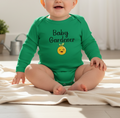 Baby wearing a green 'Baby Gardener' onesie sitting on a blanket.