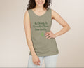 Woman wearing a green tank top with text on a beige background