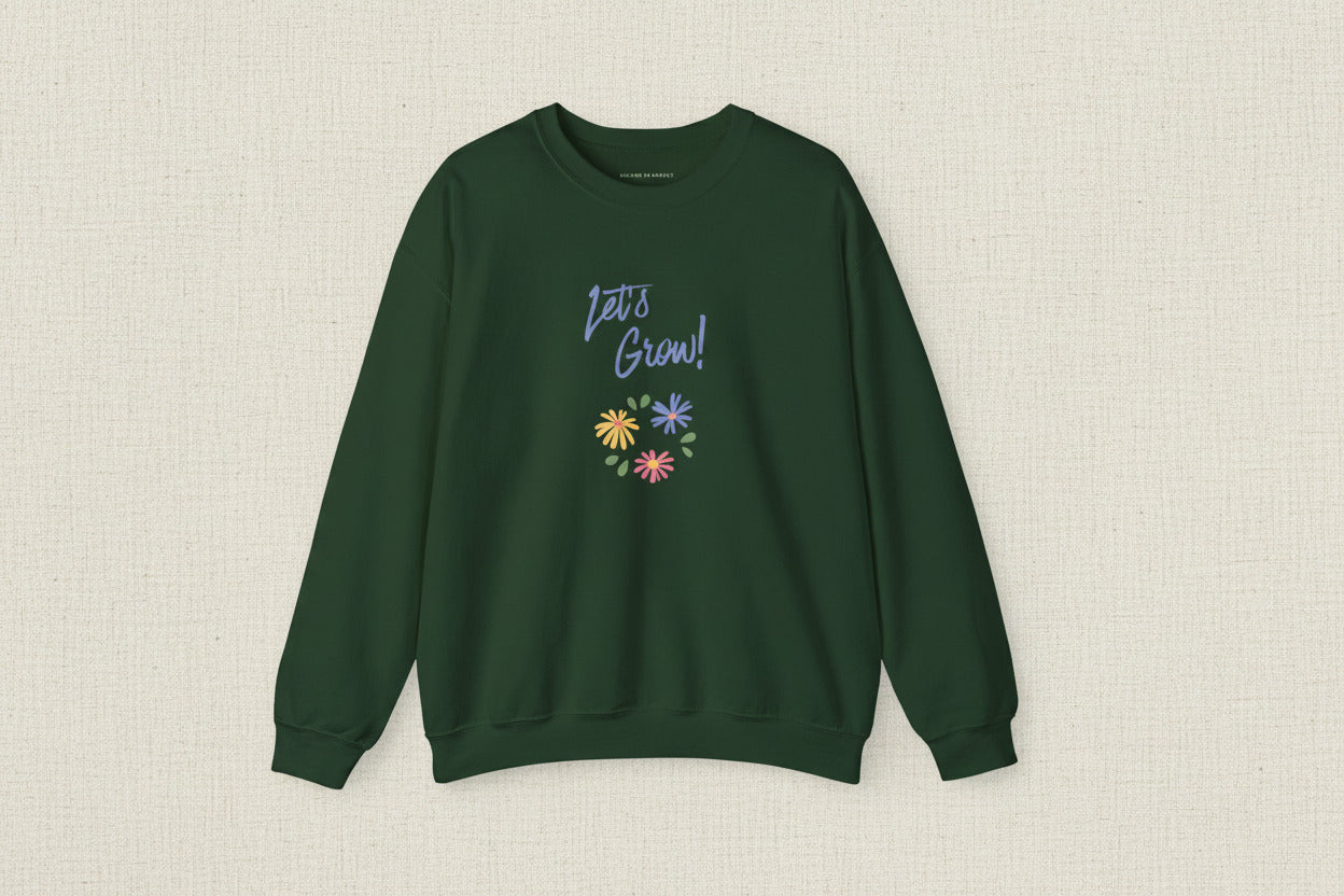 Green sweatshirt with 'Let's Grow!' text and colorful flowers on a white background