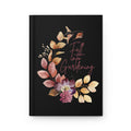 Notebook with floral design and 'Fall into Gardening' text on a black background