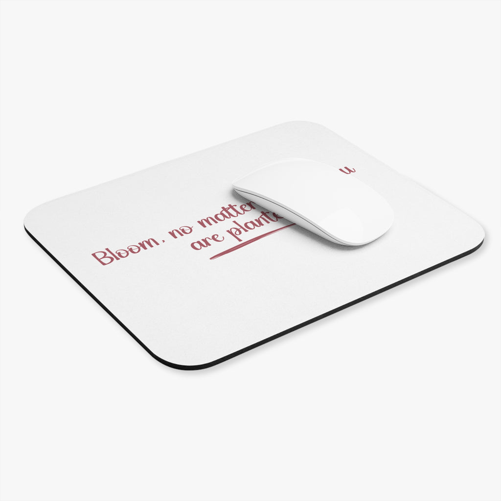 White mouse pad with red text and a white mouse on a white background