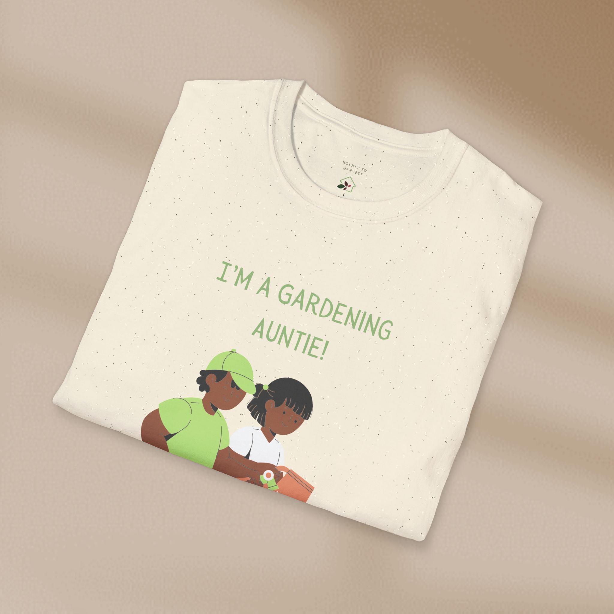 Folded t-shirt with 'I'm a Gardening Auntie!' text and graphic on a beige background