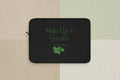 Black laptop sleeve with 'Wake Up & Garden' text and leaf design on a white background