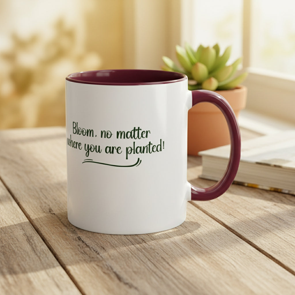 White mug with purple interior and handle featuring the text 'Bloom, no matter where you are planted!' on a beige background.