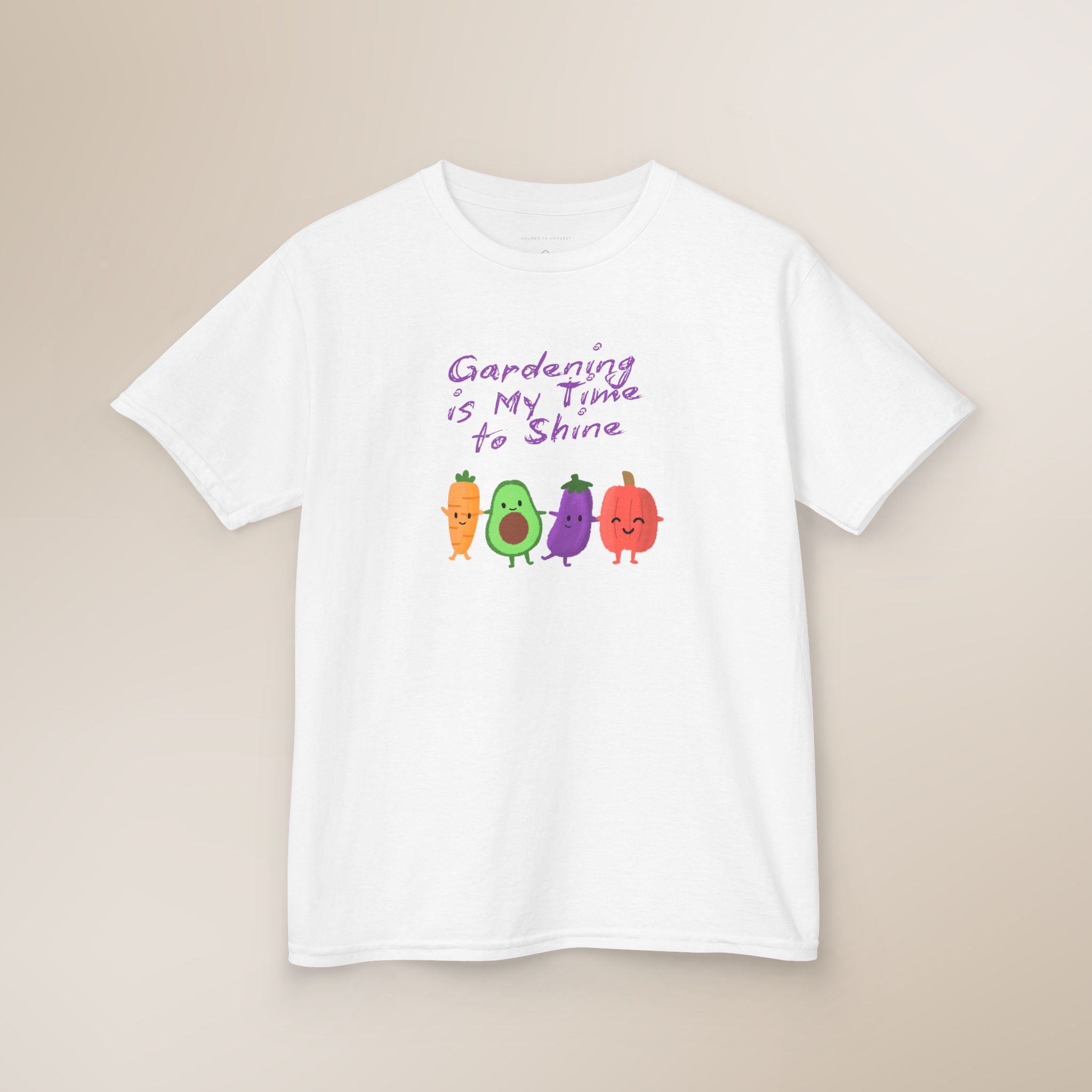 White t-shirt with cartoon vegetables and text on a beige background