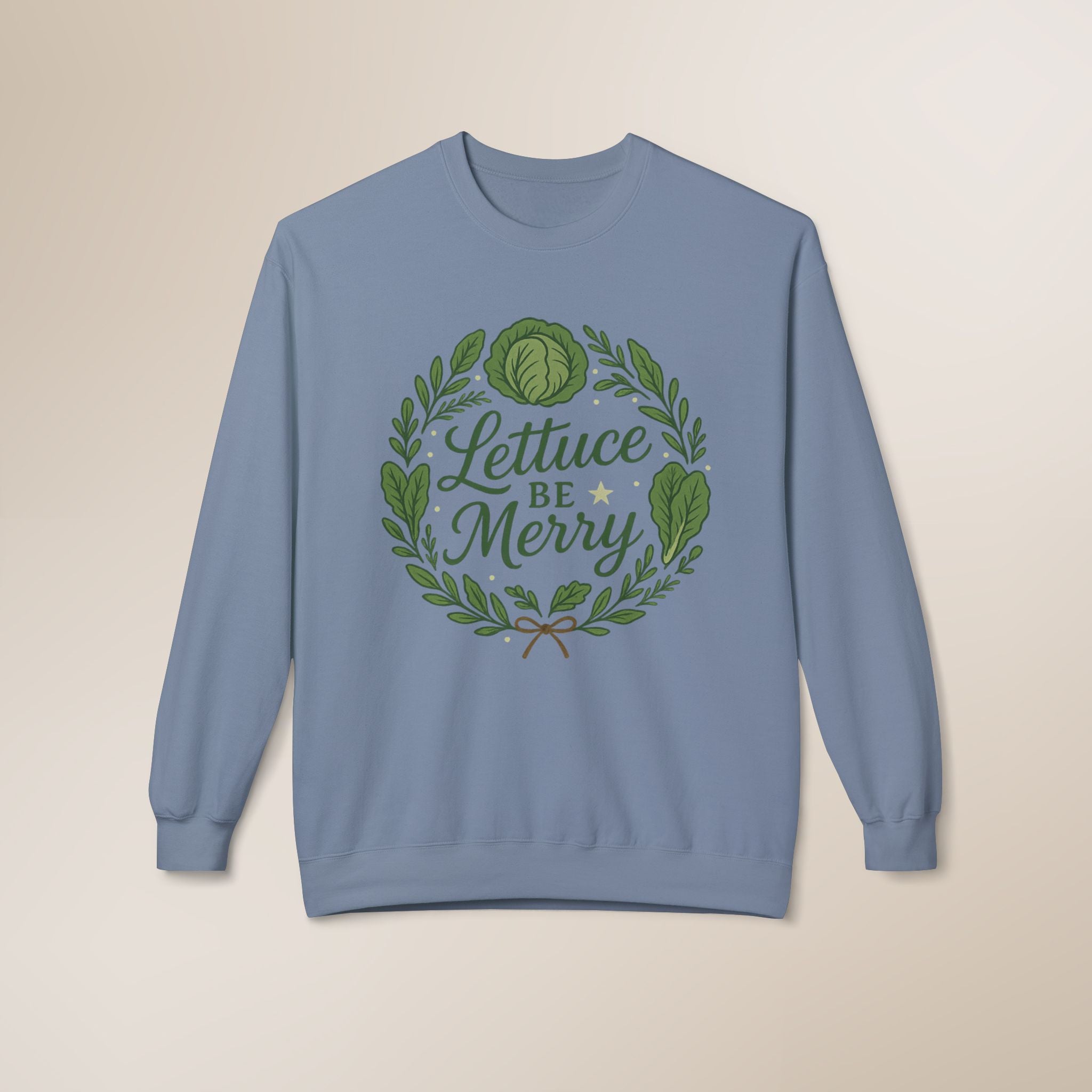 Blue sweatshirt with 'Lettuce Be Merry' design on a beige background