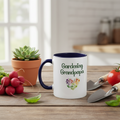 Mug with 'Gardening Grandpapa' text on a table with vegetables and plants