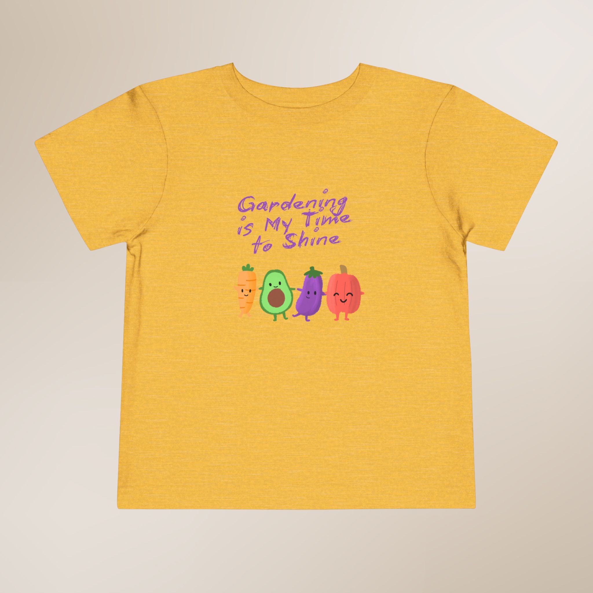 Yellow t-shirt with colorful vegetables and text on a beige background