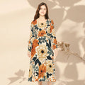 Woman wearing a floral dress with orange and yellow flowers on a beige background