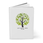 White book with green tree design and text on a white background