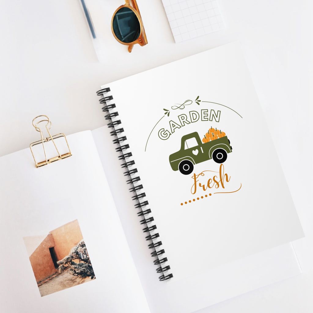 Notebook with 'Garden Fresh' design on a white surface