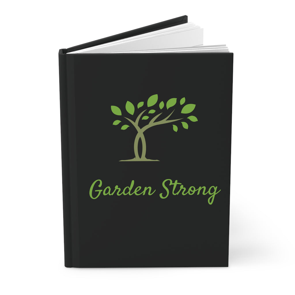 Black notebook with 'Garden Strong' and tree design on a white background