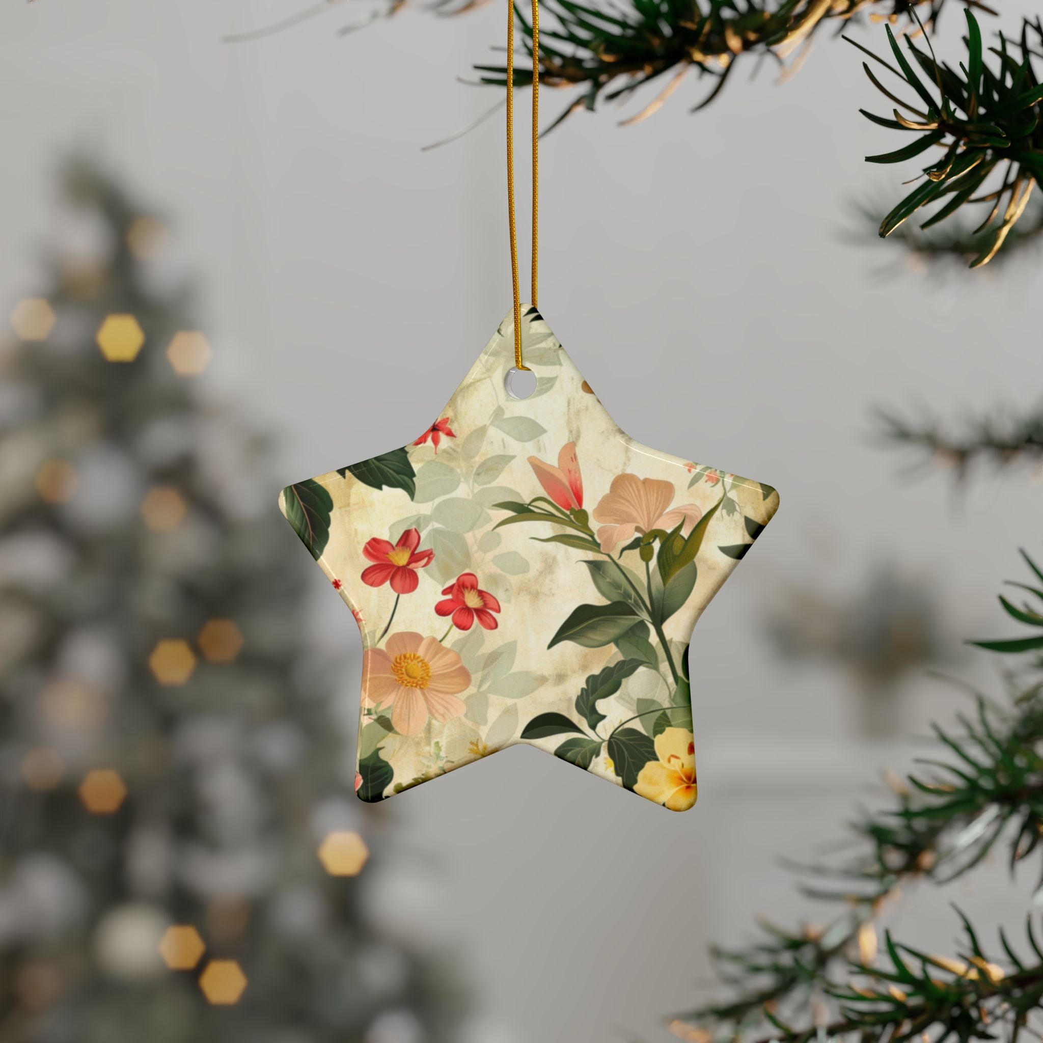 Star-shaped floral ornament hanging on a tree branch with a blurred festive background.