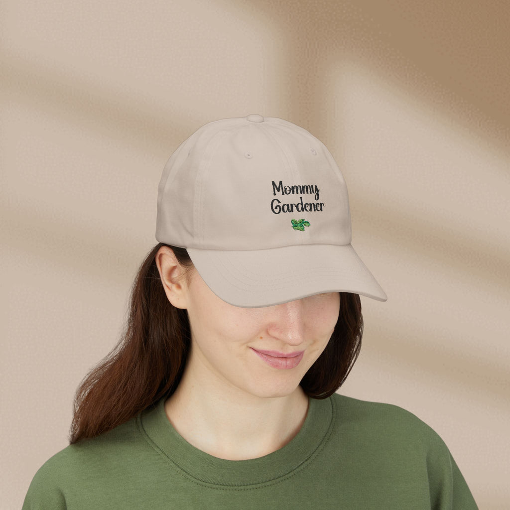 Person wearing a beige cap with 'Mommy Gardener' text on a beige background