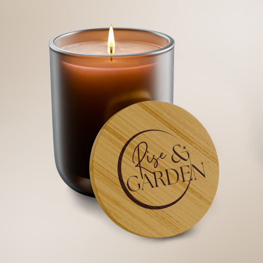 Candle in a glass jar with a wooden lid featuring 'Rise & Garden' on a beige background
