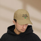 Man wearing a beige cap with 'Daddy Gardener' text on a beige background