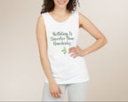 Woman wearing a white tank top with text and a plant graphic on a beige background