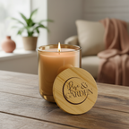 Candle with wooden lid on a table in a cozy living room setting