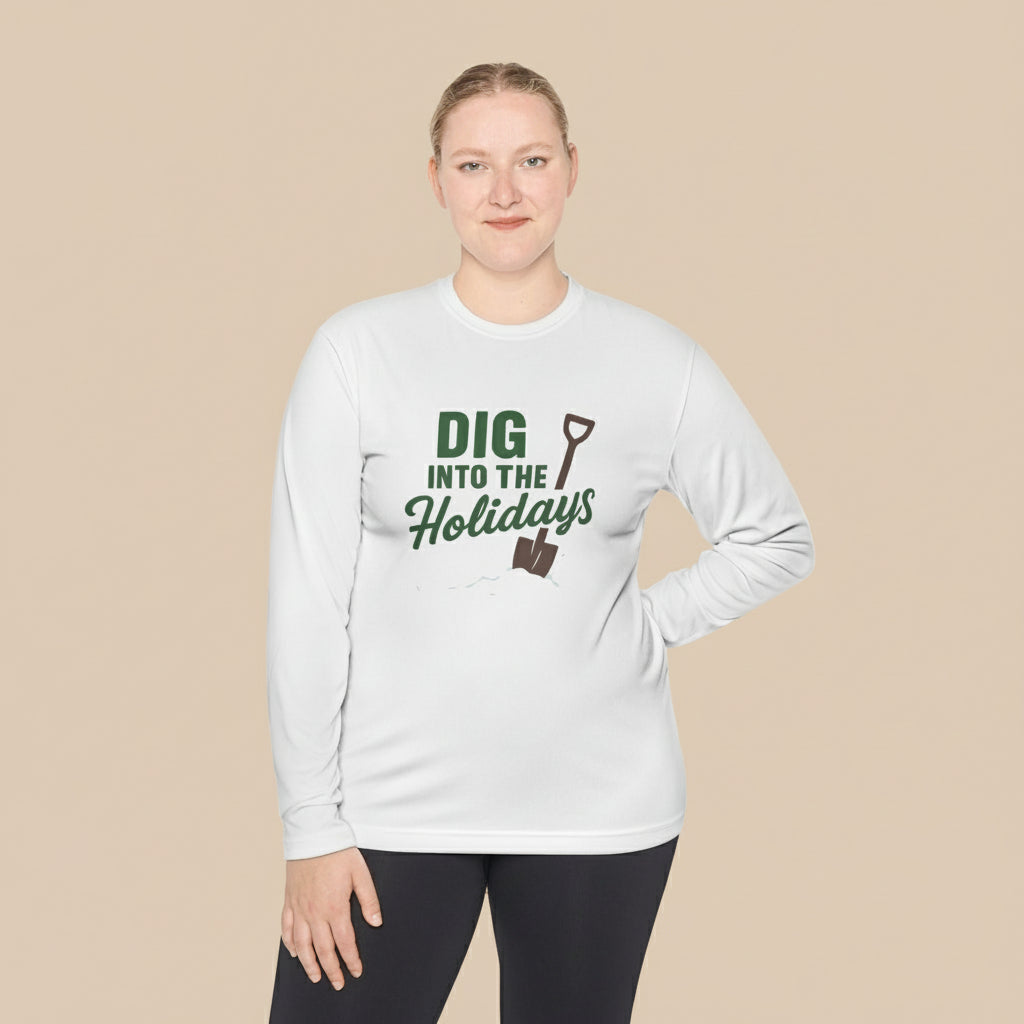 Person wearing a white long-sleeve shirt with 'DIG INTO THE HOLIDAYS' text, standing indoors.