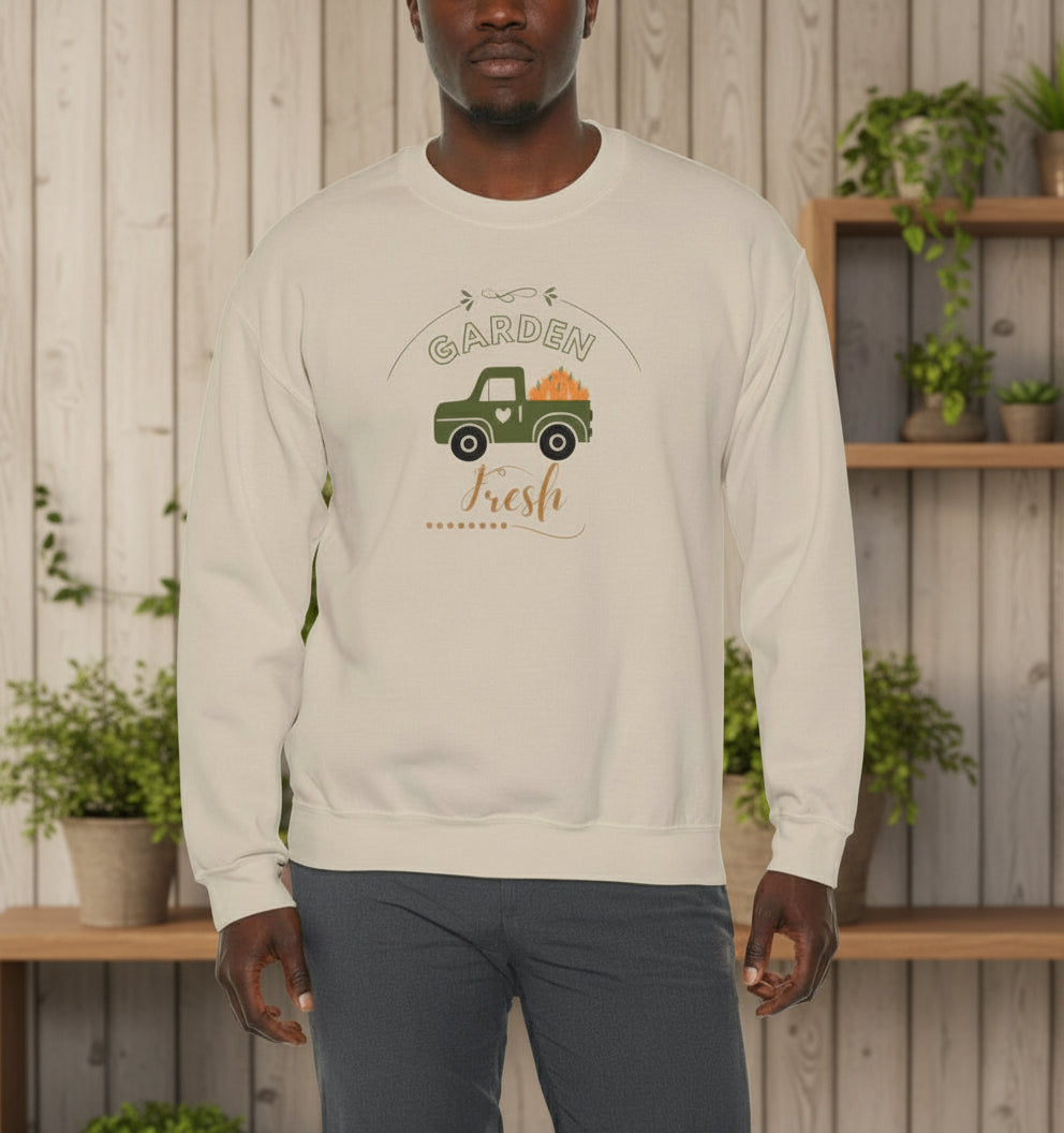 Beige sweatshirt with graphic design and text worn by a person on a white background