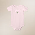 Pink baby onesie with 'Baby Bay Leaf' text and leaf graphic on a beige background