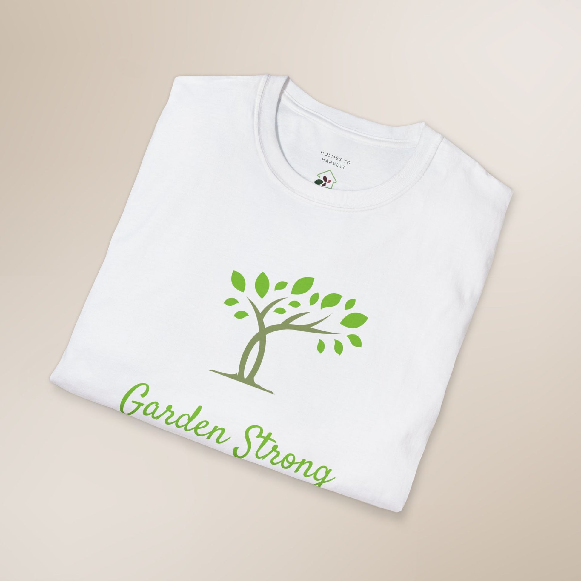 White t-shirt with 'Garden Strong' design on a beige background